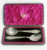 A pair of Victorian silver serving spoons, with pierced bright cut scroll engraving, London circa