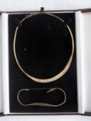 9ct three colour gold necklace of  graduating pieces and a matching bracelet in brown box