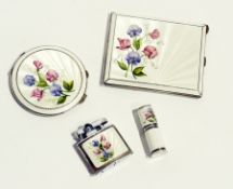 A silver and enamel lady's suite comprising cigarette case, compact, lipstick holder and a cigarette