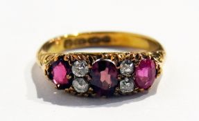 Victorian 18ct gold ruby and diamond ring set three oval rubies and four old cut diamonds, in