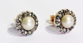 A pair of natural half-pearl and diamond earrings, each circular