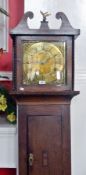 An antique oak longcase, with broken swan-neck pediment and brass bird finial, with brass dial by