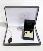 9ct gold and Whitby jet pendant, elliptical-shape on fine chain and matching pair stud earrings