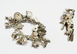 A silver charm bracelet and a quantity of charms, 44g approx. total and a silver-coloured metal