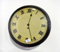 A large wall clock, painted dial with Roman numerals, oak cased, painted rim to glazed face, 33cm in
