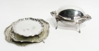 A silver plate tray with wavy edge, two silver plate salvers and a silver plate hotplate with hinged