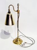 A collection of brass desk lamps including four with shell-shades, two with telescopic action,