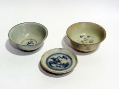 Two blue and white Chinese 17th century cargo style bowls and similar saucer