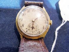 A gentleman's 18ct gold wristwatch, with silver dial and subsidiary second hand, with jewelled Swiss