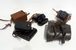A quantity of cameras, cine-camera and two pairs of binoculars (1 box)