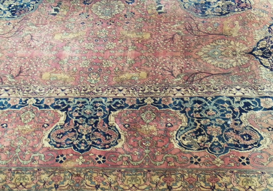 Persian design Grosvenor Wilton carpet, with blue floral spray border, green central medallions