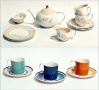 A Susie Cooper "Gay Stripes" part coffee set and a tete-a-tete china teaset, white ground, floral
