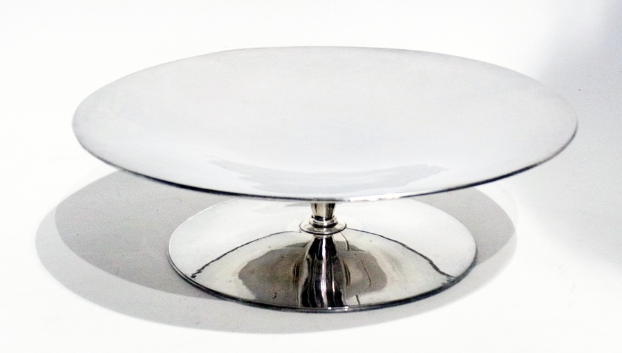 Modernist silver comport, circular with six-point star embossed to underside, on circular foot, 23cm