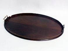 Inlaid mahogany two-handled tray with plain galleried border, 67cm long