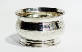 A George V silver bowl with reeded border, on a raised circular foot, London 1910, 11cm diameter