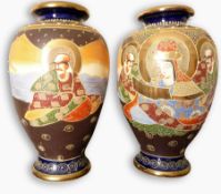 A pair of Japanese Kutani ovoid vases, decorated figures, 31cm high