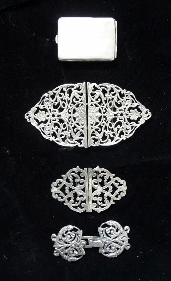 A nurse's silver buckle, London 1968, two other white metal buckles and a lady's engine turned