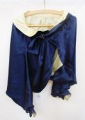 Blue satin evening jacket with cream silk lining and antique cut steel buckle