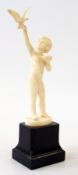 Ferdinand Preiss carved ivory figure of a young boy feeding a dove, circa 1930, signed "F.Preiss" on