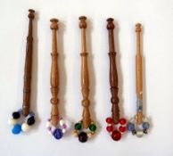 A quantity of wooden lace bobbins and others made into earrings (2 boxes)