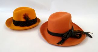 Assorted coloured hats, to include:- red trilby, orange trilby, green hat, yellow hat and others (7)