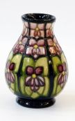 Moorcroft pottery "Violet" vase, baluster-shaped having violet-coloured stylised flowers with