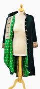 A velvet evening coat, lined with sari silk, bottle green with mandarin collar, brocade to the cuffs