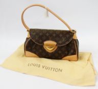 A Louis Vuitton 'Beverley' shoulder bag, monogram, 31cm wide with Louis Vuitton headed paper and