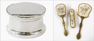 A 1940's silver powder bowl and cover, Birmingham 1948 and a dressing table set of three pieces