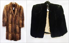 A Fawkes of Birmingham long fur coat and a black faux-fur cape (2)