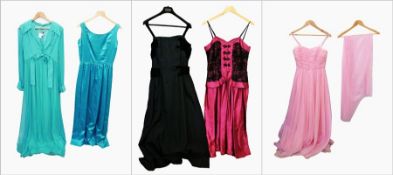 A quantity of evening gowns to include:- a part pink evening gown with black lace, a black and