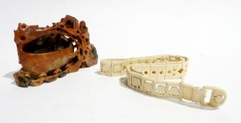 A carved ivory linked belt, ivory bead necklaces and a soapstone figure