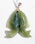 An Eastern carved jadeite pendant of a pair of fish