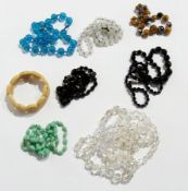 A quantity of costume jewellery to include:- glass bead necklaces, etc.