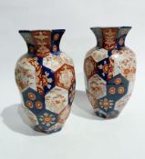Pair Japanese large Imari porcelain vases, each ovoid and hexagonal panelled with everted rim,