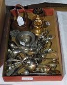 A quantity of plated items to include:- sugar tongs, coffee spoons, watch stand, dwarf candlesticks,