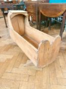 Early 19th century pine baby's hooded crib, on rocker supports, length 90cm