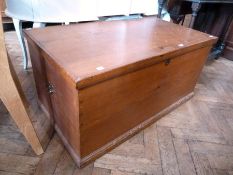 A 19th century pine blanket box, raised on a plinth base with side carrying handles, width 95cm