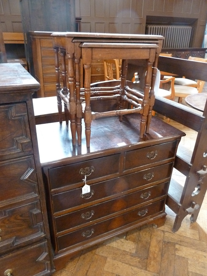 Reproduction mahogany chest of two short and three long drawers, with brass drop handles, pierced