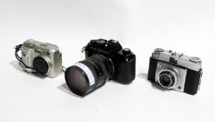 A Yashica FX-3 camera together with telephoto lens and two others (3)