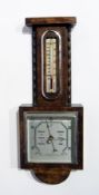 Mid 20th century oak cased aneroid barometer with angular pediment and wave moulding flanking the