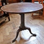 An 18th century mahogany circular top occasional table, with birdcage and turned gun barrel