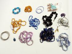 A quantity of costume jewellery to include:- bead necklaces, various