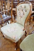 Victorian walnut drawing room chair, the buttoned waisted back with foliate scroll carved