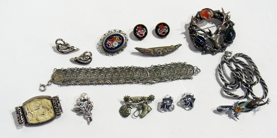 A quantity of costume jewellery to include:- bead necklaces, brooches, etc.