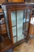 Mid 20th century mahogany display cabinet, having two glass shelves, enclosed by astragal-glazed