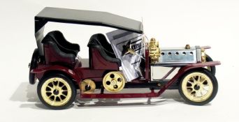 A Mamod live steam model of a veteran motor car