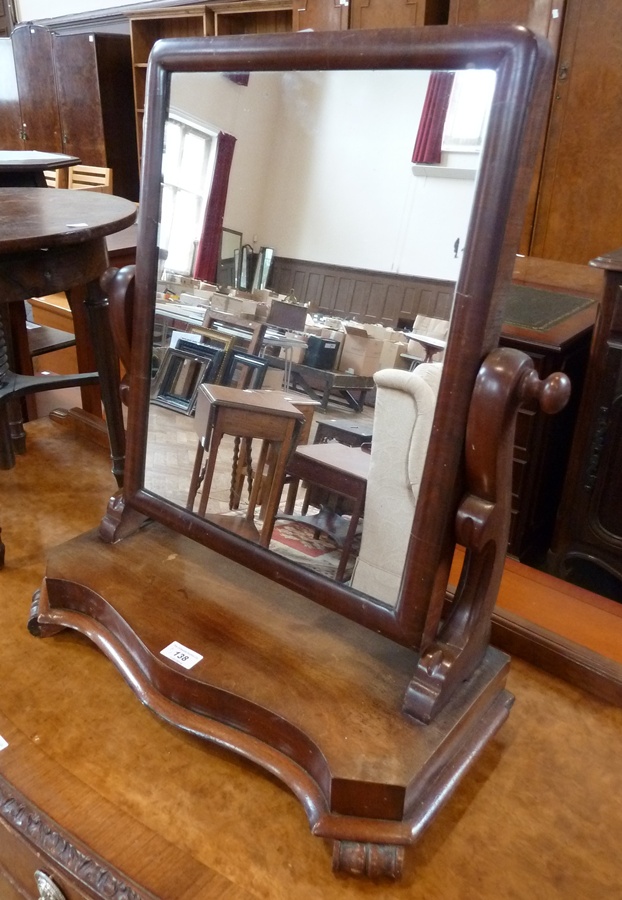 Victorian mahogany toilet mirror, the rectangular plate on scroll supports, serpentine fronted