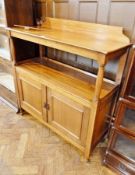 20th century mahogany buffet with shelved top, further open shelf with cupboards below, turned