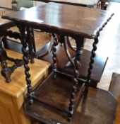 Two oak cane topped stools, an oak wavy edge side table with spiral supports, an octagonal top